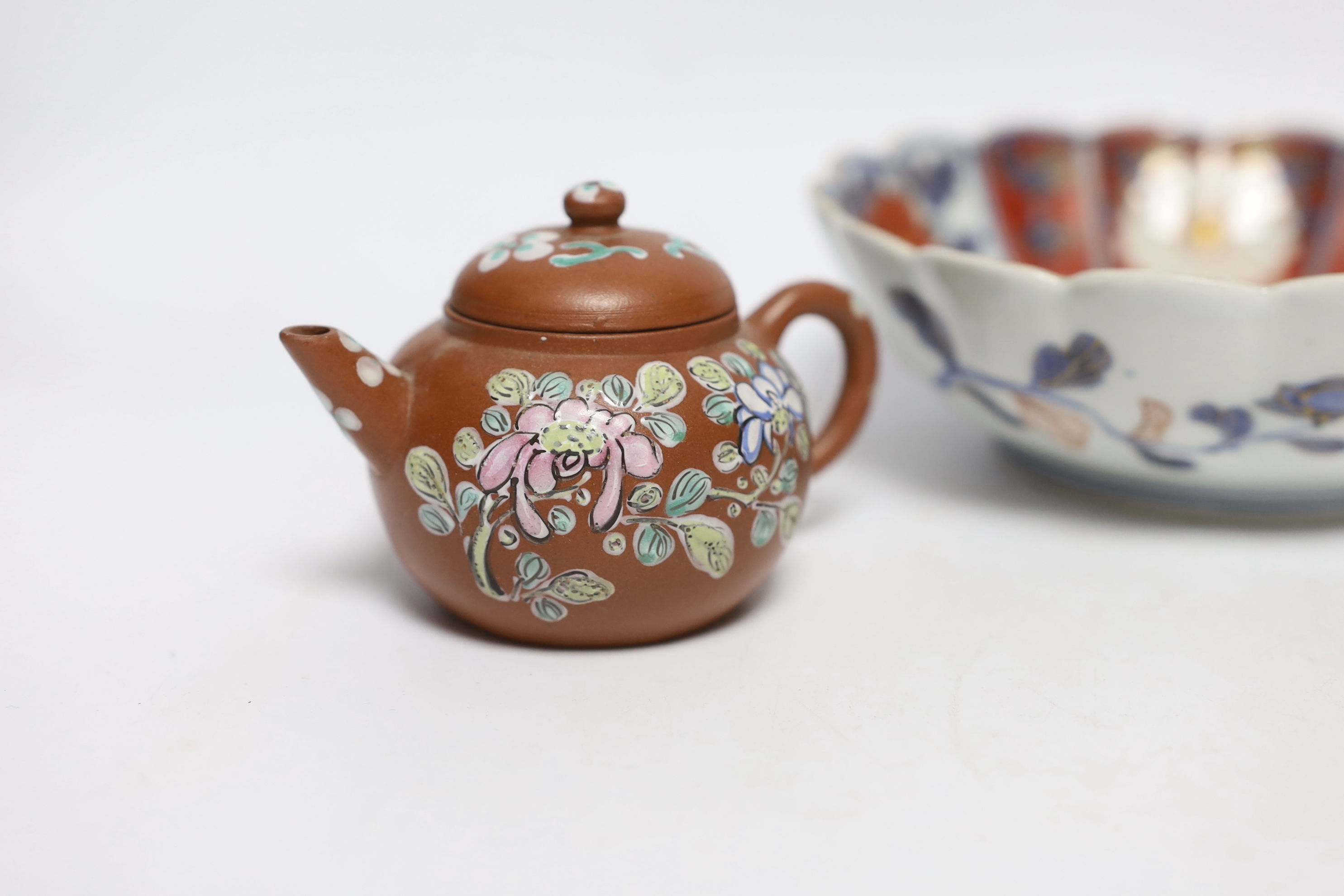 A Chinese enamelled yixing teapot and cloisonné bowl together with a Japanese Imari bowl and a Satsuma seated figure of a Buddhist monk, tallest 14cm